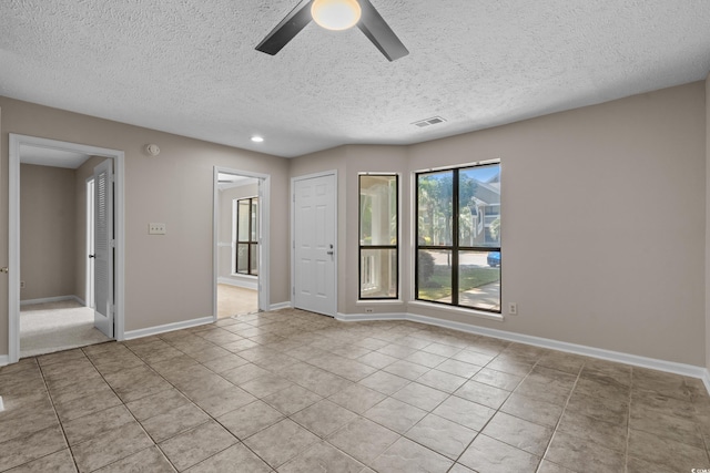 900 Courtyard Dr Unit K7, Myrtle Beach, SC 29577 - spare room with a textured ceiling, visible vents, light tile patterned flooring, and ceiling fan