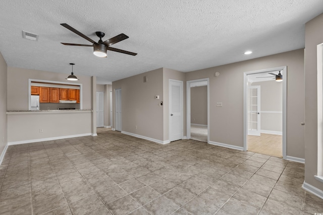 900 Courtyard Dr Unit K7, Myrtle Beach, SC 29577 - unfurnished living room with a textured ceiling, visible vents, baseboards, ceiling fan, and recessed lighting