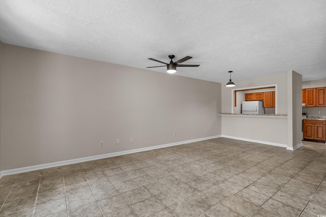 900 Courtyard Dr Unit K7, Myrtle Beach, SC 29577 - unfurnished living room featuring a textured ceiling, baseboards, and a ceiling fan