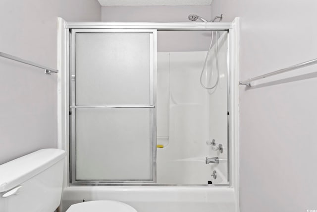 2258 Essex Dr Unit G, Surfside Beach, SC 29575 - full bath with toilet, a textured ceiling, and shower / bath combination with glass door