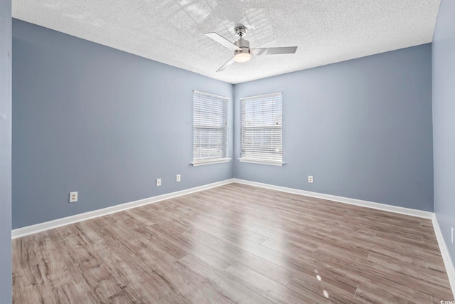 2258 Essex Dr Unit G, Surfside Beach, SC 29575 - spare room featuring a textured ceiling, wood finished floors, baseboards, and ceiling fan