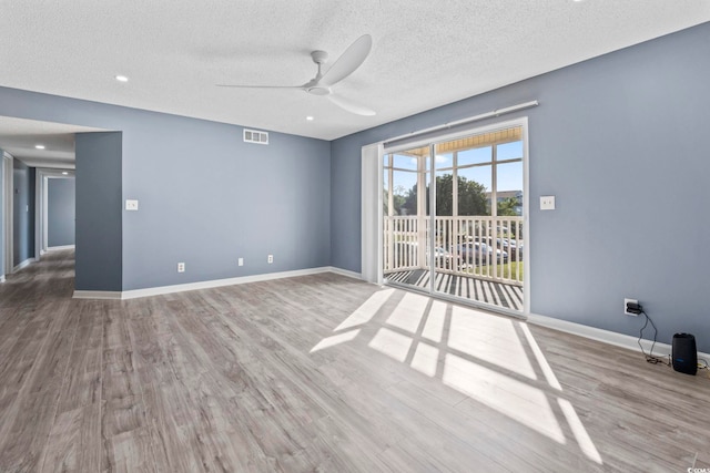 2258 Essex Dr Unit G, Surfside Beach, SC 29575 - unfurnished room with wood finished floors, a textured ceiling, visible vents, baseboards, and ceiling fan