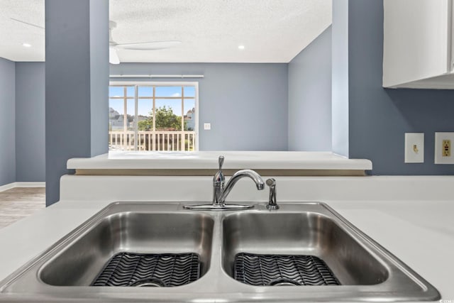 2258 Essex Dr Unit G, Surfside Beach, SC 29575 - interior details with light countertops, a textured ceiling, ceiling fan, and a sink