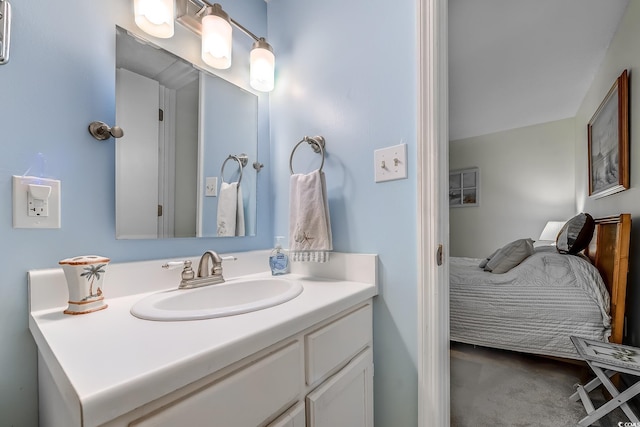 bathroom featuring connected bathroom and vanity