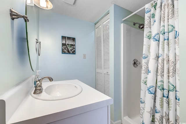 full bathroom with a shower with curtain, a closet, and vanity
