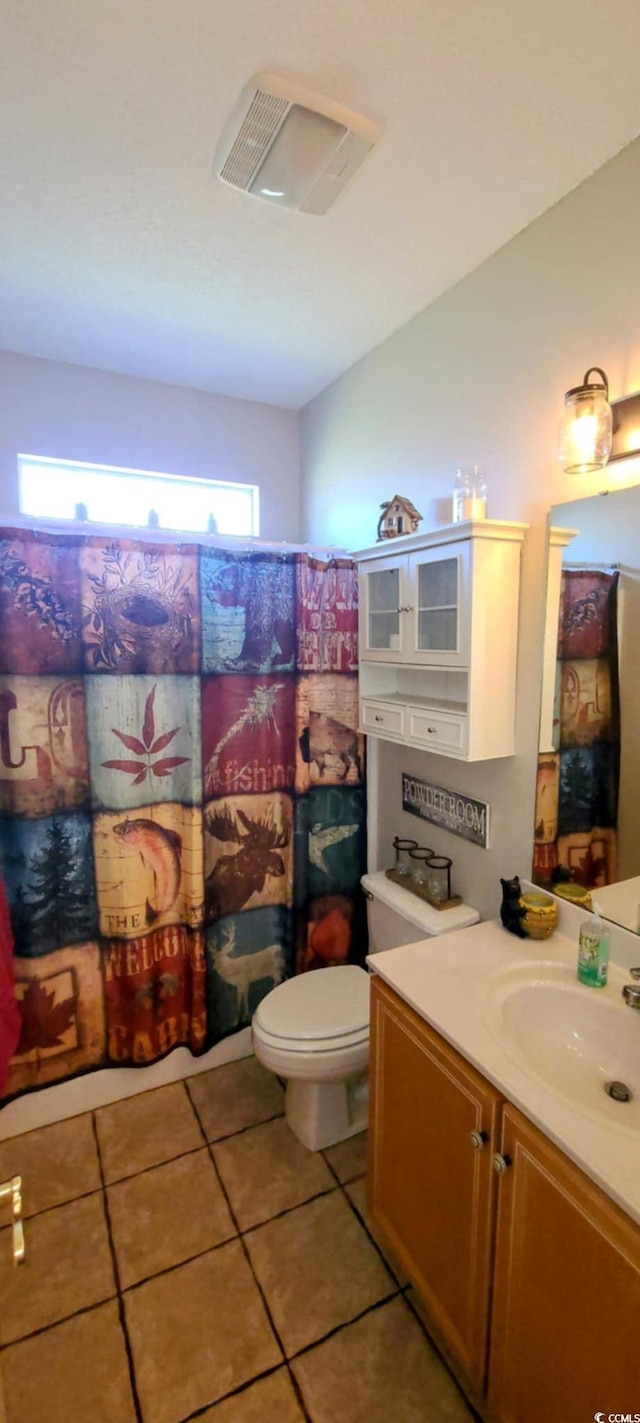 1717 Perdiz Covey Ct, Myrtle Beach, SC 29588 - bathroom with tile patterned floors, toilet, vanity, and curtained shower