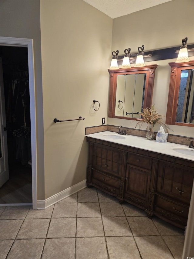 1717 Perdiz Covey Ct, Myrtle Beach, SC 29588 - bathroom featuring double vanity, tile patterned floors, and baseboards