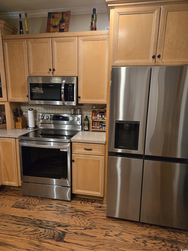 1717 Perdiz Covey Ct, Myrtle Beach, SC 29588 - kitchen with stainless steel appliances, light brown cabinets, crown molding, light countertops, and tasteful backsplash