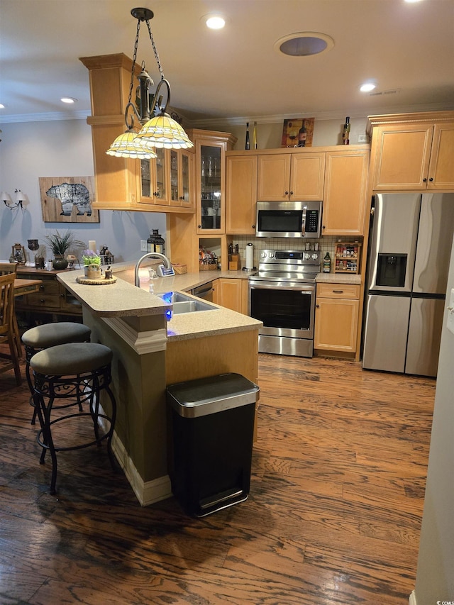 1717 Perdiz Covey Ct, Myrtle Beach, SC 29588 - kitchen featuring appliances with stainless steel finishes, a sink, a peninsula, light countertops, and glass insert cabinets