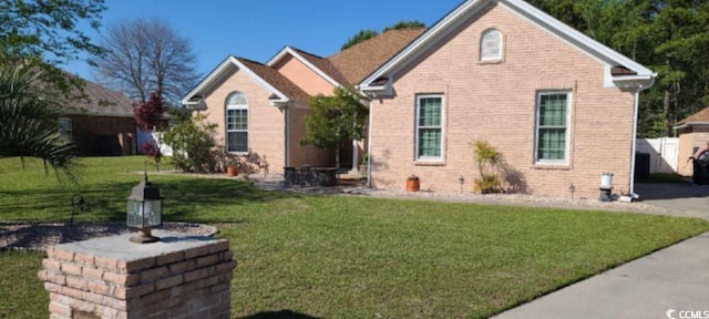 1717 Perdiz Covey Ct, Myrtle Beach, SC 29588 - traditional-style home with a front lawn and brick siding