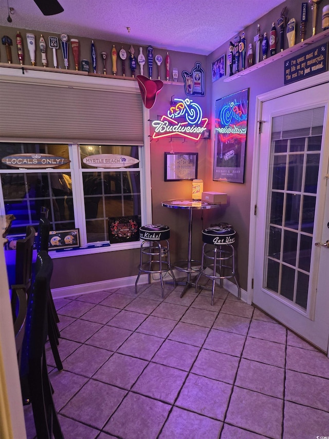 1717 Perdiz Covey Ct, Myrtle Beach, SC 29588 - bar featuring tile patterned floors and a textured ceiling