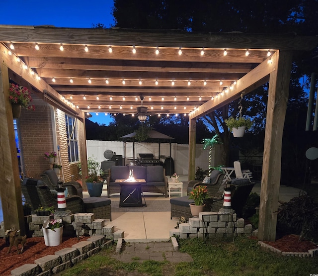 1717 Perdiz Covey Ct, Myrtle Beach, SC 29588 - patio at twilight featuring a fire pit, a fenced backyard, a pergola, and a patio area