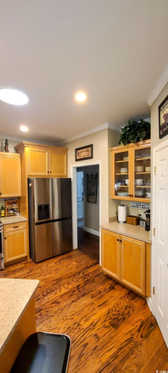 1717 Perdiz Covey Ct, Myrtle Beach, SC 29588 - kitchen with stainless steel appliances, ornamental molding, light countertops, dark wood-style flooring, and glass insert cabinets