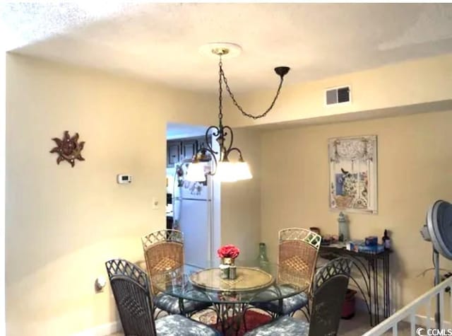 913 Villa Dr Unit 913, North Myrtle Beach, SC 29582 - dining space with visible vents and baseboards