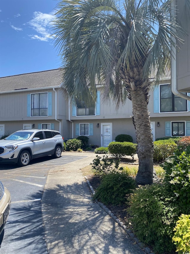 913 Villa Dr Unit 913, North Myrtle Beach, SC 29582 - view of property featuring uncovered parking