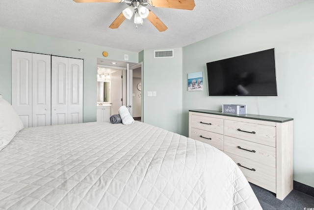 205 74th Ave N Unit 1104, Myrtle Beach, SC 29572 - bedroom featuring a textured ceiling, ceiling fan, a closet, and connected bathroom