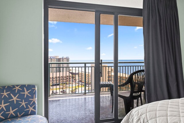 205 74th Ave N Unit 1104, Myrtle Beach, SC 29572 - bedroom featuring a water view, carpet, and multiple windows