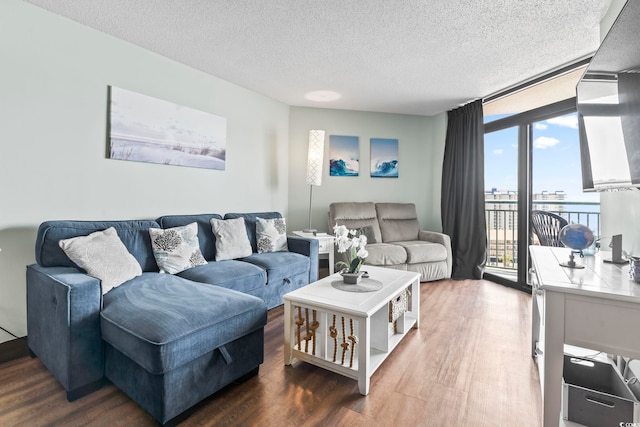 205 74th Ave N Unit 1104, Myrtle Beach, SC 29572 - living room with wood finished floors and a textured ceiling