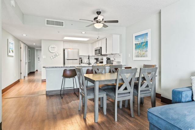 205 74th Ave N Unit 1104, Myrtle Beach, SC 29572 - dining room with a ceiling fan, wood finished floors, baseboards, and recessed lighting