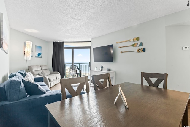 205 74th Ave N Unit 1104, Myrtle Beach, SC 29572 - dining room featuring a textured ceiling and a wall of windows