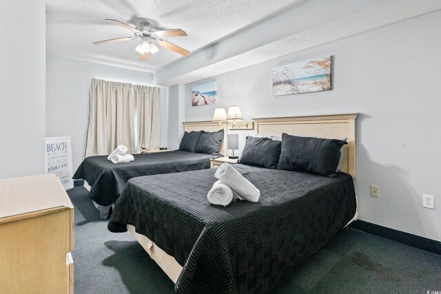 205 74th Ave N Unit 1104, Myrtle Beach, SC 29572 - bedroom with carpet floors, ceiling fan, and baseboards