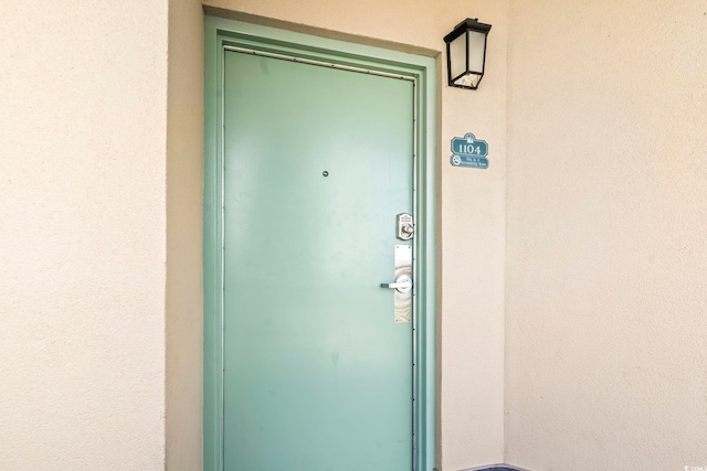 205 74th Ave N Unit 1104, Myrtle Beach, SC 29572 - doorway to property featuring stucco siding