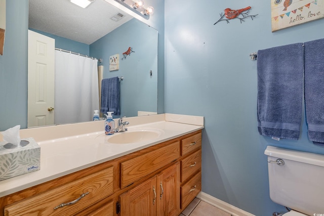 706 Chippendale Dr, Myrtle Beach, SC 29588 - full bathroom featuring toilet, vanity, visible vents, tile patterned flooring, and baseboards