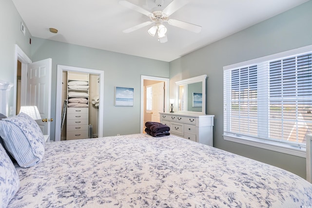 bedroom with a ceiling fan, a spacious closet, and a closet