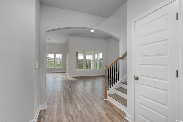 4031 Bucolic Loop, Myrtle Beach, SC 29588 - interior space featuring light wood finished floors, baseboards, arched walkways, and stairs