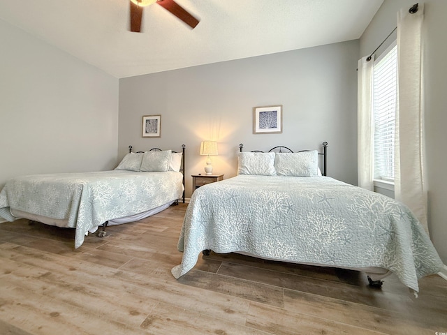 bedroom featuring a ceiling fan and wood finished floors