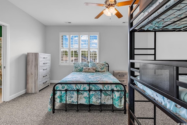 bedroom with baseboards, carpet floors, and a ceiling fan