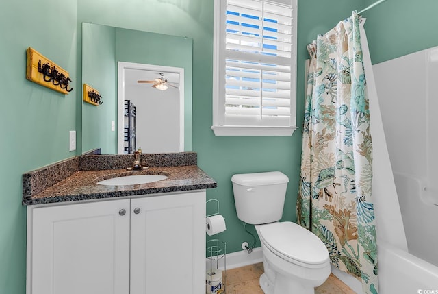 bathroom featuring baseboards, toilet, vanity, a ceiling fan, and shower / bath combination with curtain