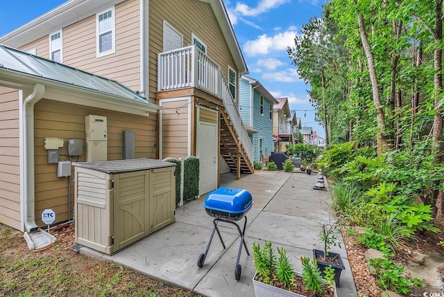 view of patio / terrace with stairs and grilling area