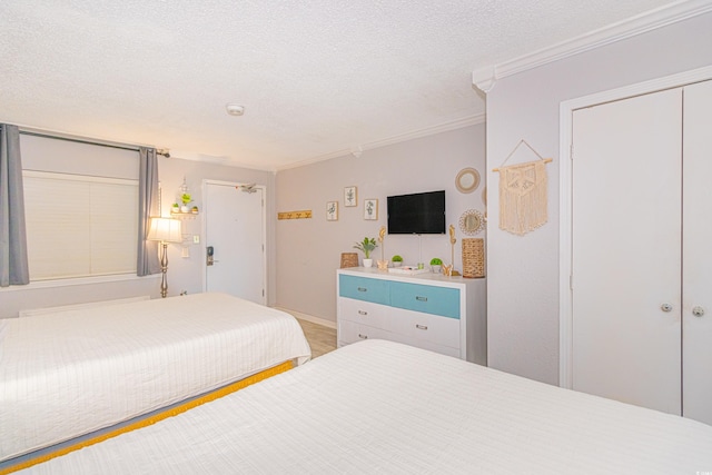 200 76th Ave N Unit 408, Myrtle Beach, SC 29572 - bedroom with a textured ceiling and ornamental molding