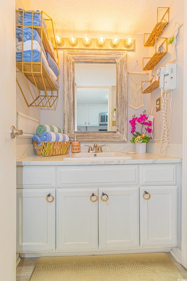 200 76th Ave N Unit 408, Myrtle Beach, SC 29572 - bathroom with vanity and a textured ceiling