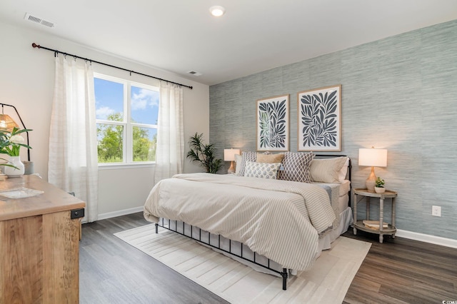 1406 Nokota Dr, Conway, SC 29526 - bedroom featuring wood finished floors, wallpapered walls, and an accent wall