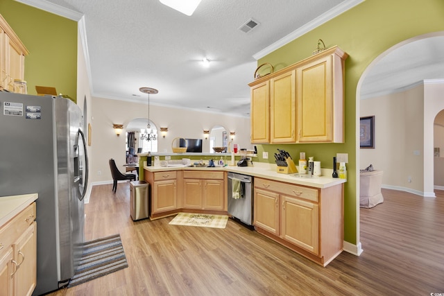 kitchen with arched walkways, stainless steel appliances, light brown cabinetry, a peninsula, and crown molding