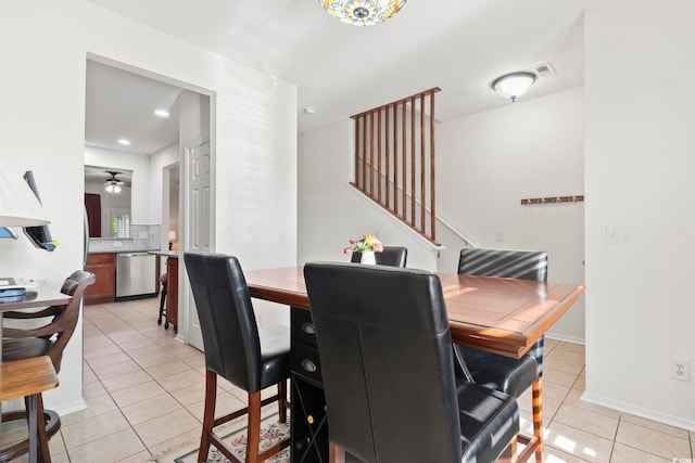 157 Olde Towne Way Unit 4, Myrtle Beach, SC 29588 - dining room with stairs, visible vents, a ceiling fan, light tile patterned floors, and baseboards