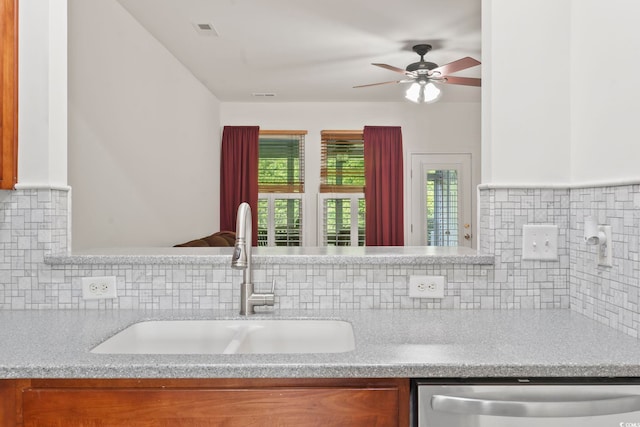 157 Olde Towne Way Unit 4, Myrtle Beach, SC 29588 - kitchen with stainless steel dishwasher, backsplash, light countertops, and a sink