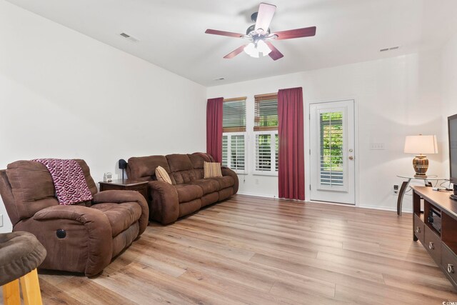 157 Olde Towne Way Unit 4, Myrtle Beach, SC 29588 - living area with baseboards, a ceiling fan, visible vents, and light wood-style floors