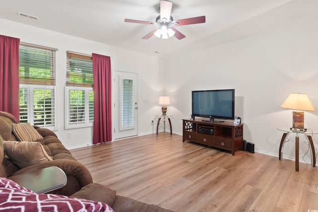 157 Olde Towne Way Unit 4, Myrtle Beach, SC 29588 - living area featuring baseboards, ceiling fan, light wood finished floors, and visible vents