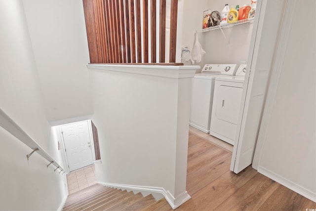 157 Olde Towne Way Unit 4, Myrtle Beach, SC 29588 - laundry area featuring washing machine and clothes dryer, light wood-type flooring, and baseboards