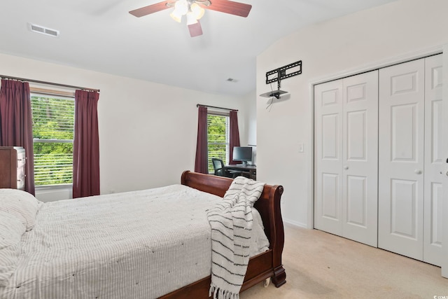 157 Olde Towne Way Unit 4, Myrtle Beach, SC 29588 - bedroom with a closet, light colored carpet, visible vents, vaulted ceiling, and ceiling fan