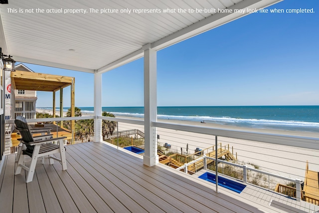 wooden deck with a water view and a view of the beach