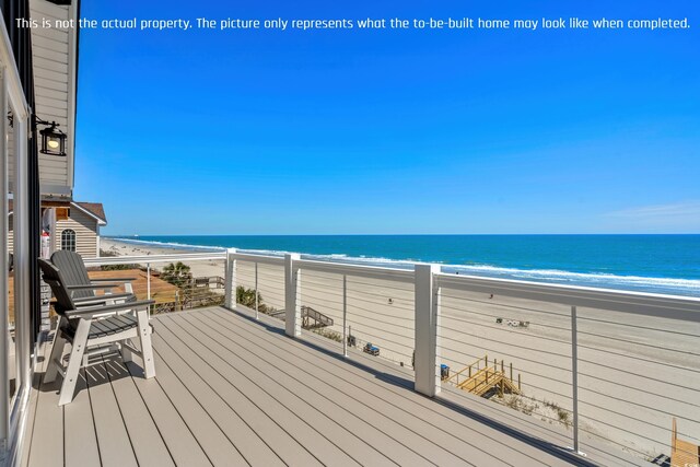 wooden deck with a water view and a view of the beach