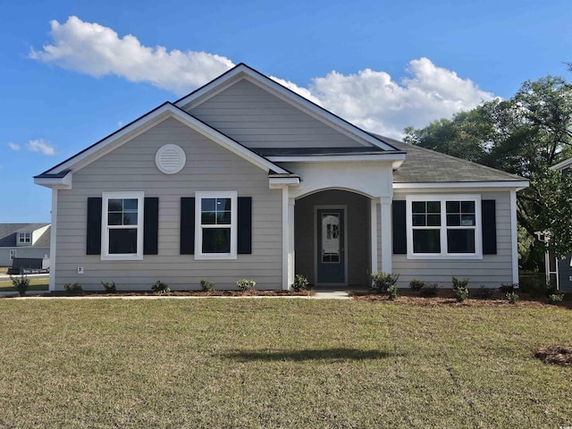 725 Choctaw Dr, Conway, SC 29526 - view of front facade featuring a front lawn and roof with shingles