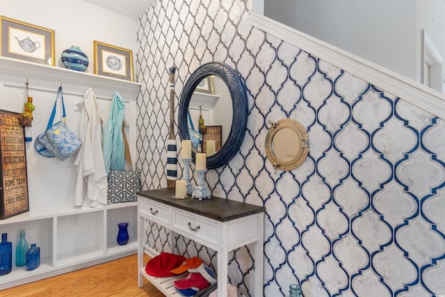 mudroom featuring wallpapered walls and light wood-style flooring