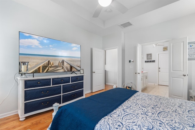 bedroom featuring baseboards, ceiling fan, light wood-style floors, and visible vents