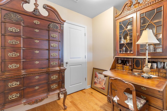 office space featuring wood finished floors and baseboards