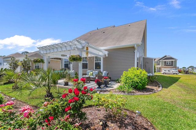 back of property with a yard, a pergola, an outdoor hangout area, a patio area, and roof with shingles